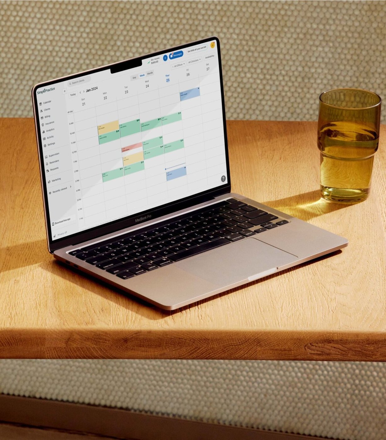 SimplePractice colour-coded scheduling calendar on a laptop